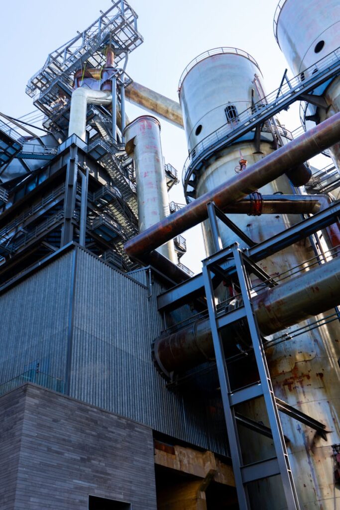 A detailed view of a large industrial refinery with metal structures in Luxembourg.